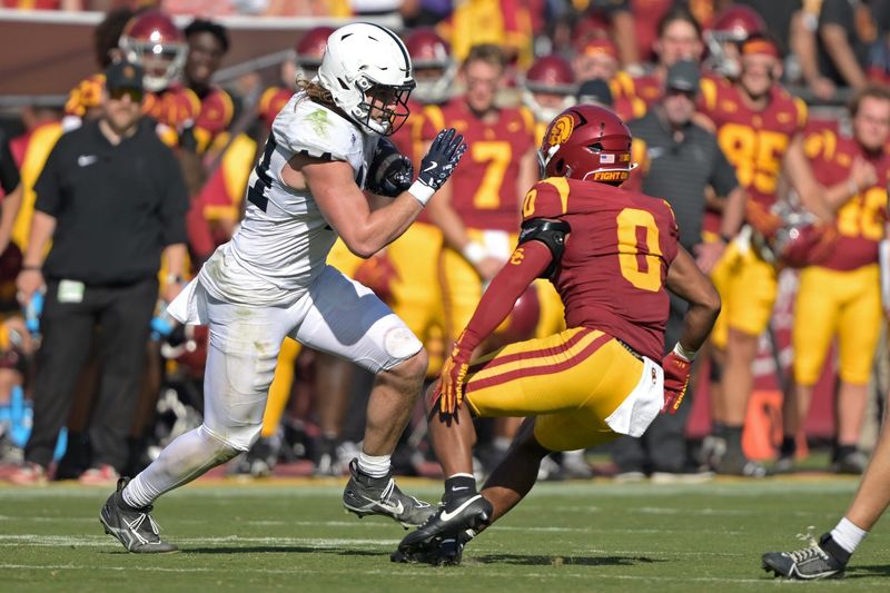 Oct 12, 2024; Los Angeles, California, USA; Penn State Nittany Lions tight end Tyler Warren (44) runs by USC Trojans safety Akili Arnold (0) in the second half at United Airlines Field at Los Angeles Memorial Coliseum. Mandatory Credit: Jayne Kamin-Oncea-Imagn Images