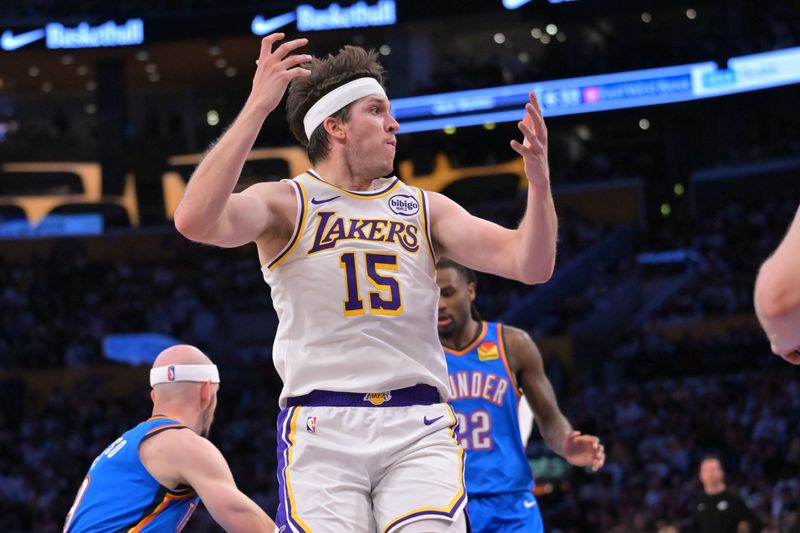May 9, 2026; Los Angeles, California, USA; Los Angeles Lakers guard Austin Reaves (15) reacts after not getting a foul call on Oklahoma City Thunder center Isaiah Hartenstein (55) in the first half of game three of the second round of the 2026 NBA Playoffs at Crypto.com Arena. Mandatory Credit: Jayne Kamin-Oncea-Imagn Images