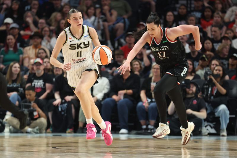 May 9, 2026; Portland, Oregon, USA; Chicago Sky guard Gabriela Jaquez (11) dribbles the bal up the court past Portland Fire center Megan Gustafson (17) in the first half at Moda Center. Mandatory Credit: Jaime Valdez-Imagn Images