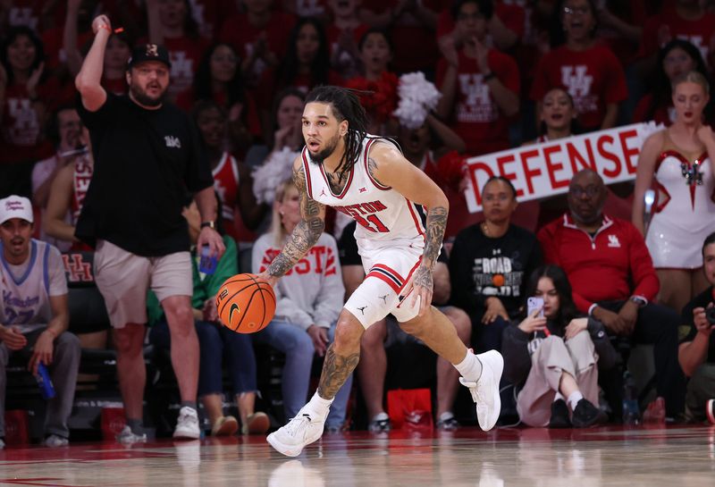 Mar 4, 2026; Houston, Texas, USA; Houston Cougars guard Emanuel Sharp (21) dribbles against the Baylor Bears in the second half at Fertitta Center. Mandatory Credit: Thomas Shea-Imagn Images