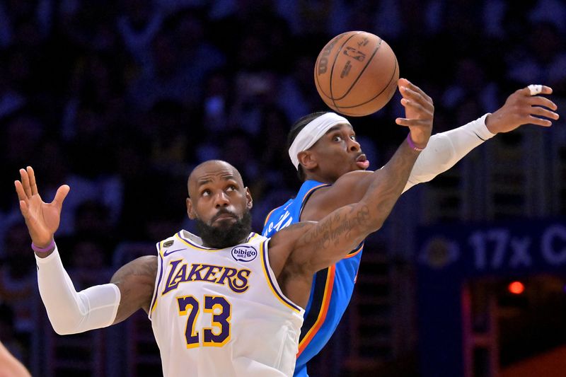 May 9, 2026; Los Angeles, California, USA; Oklahoma City Thunder guard Shai Gilgeous-Alexander (2) defends Los Angeles Lakers forward LeBron James (23) in the second half of game three of the second round of the 2026 NBA Playoffs at Crypto.com Arena. Mandatory Credit: Jayne Kamin-Oncea-Imagn Images