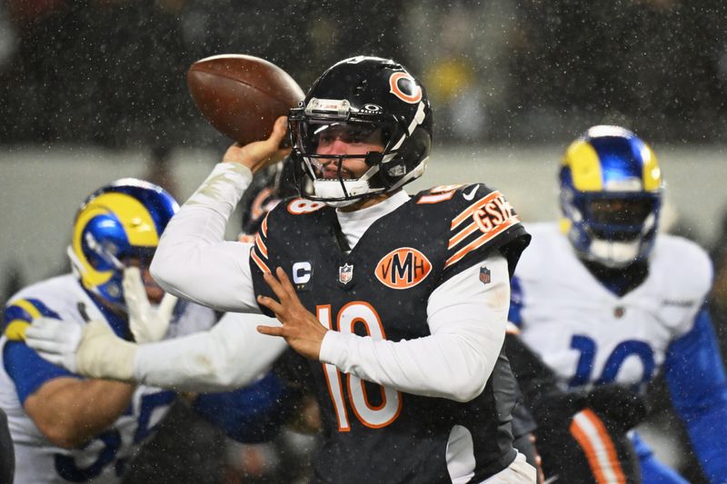 Jan 18, 2026; Chicago, IL, USA; Chicago Bears quarterback Caleb Williams (18) throws a pass against the Los Angeles Rams during the third quarter of an NFC Divisional Round game at Soldier Field. Mandatory Credit: Matt Marton-Imagn Images