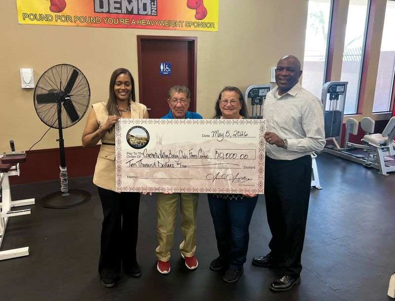 Lee and June Espinoza (middle) accept a donation to the Coachella Valley Boxing Club from the Augustine tribe on May 5, 2026.
