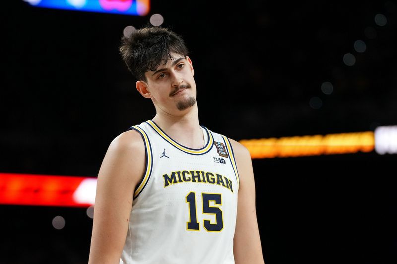 Apr 6, 2026; Indianapolis, IN, USA; Michigan Wolverines center Aday Mara (15) reacts after a play against the UConn Huskies during the first half in the national championship of the Final Four of the men's 2026 NCAA Tournament between the and the Michigan Wolverines at Lucas Oil Stadium. Mandatory Credit: Bob Donnan-Imagn Images