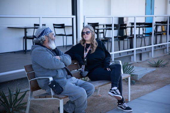 A counselor speaks with a client residing at the Victorville Wellness Center. City leaders are touting its center for a decrease in the city's homeless population, with the numbers revealed in the 2026 Point in Time Count survey