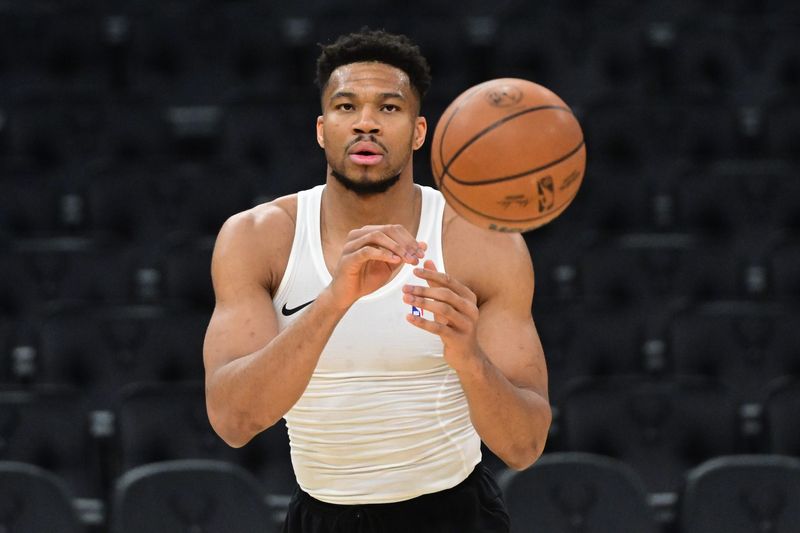Mar 31, 2026; Milwaukee, Wisconsin, USA; Milwaukee Bucks forward Giannis Antetokounmpo (34) warms up before a game against the Dallas Mavericks at Fiserv Forum. Mandatory Credit: Benny Sieu-Imagn Images
