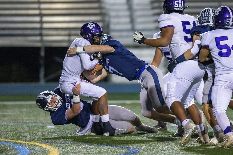 Cherry Hill West's Jordon DeJesus Gonzalez is sacked by Middletown South's Colin Gallagher and Luke Wafle during the first half of the Cherry Hill West vs. Middletown South NJSIAA Central Group 4 playoff football game at Middletown High School South in Middletown, NJ Friday, October 28, 2022.

Mid03