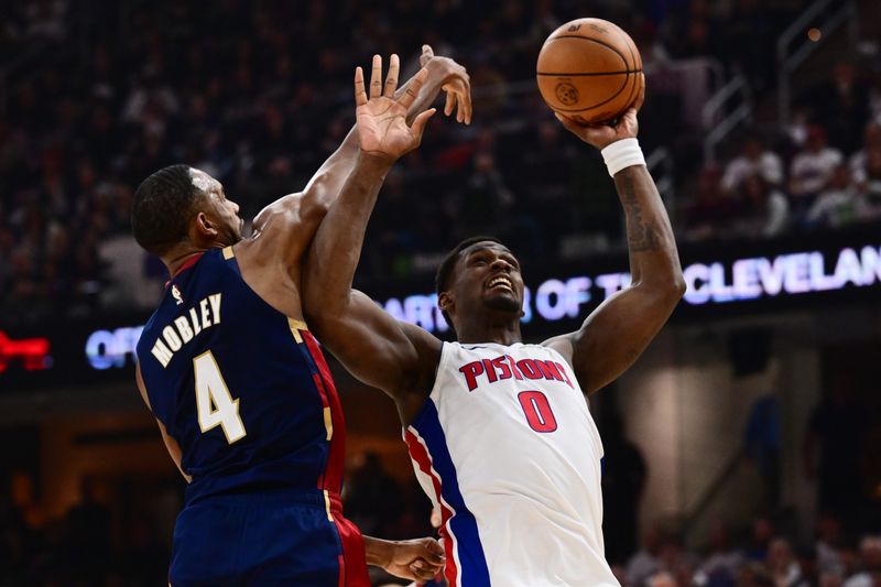 May 11, 2026; Cleveland, Ohio, USA; Detroit Pistons center Jalen Duren (0) drives to the basket against Cleveland Cavaliers center Evan Mobley (4) during the first half of game four in the second round of the 2026 NBA Playoffs at Rocket Arena. Mandatory Credit: Ken Blaze-Imagn Images