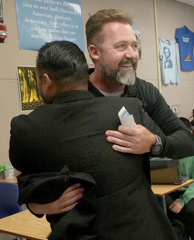 John Beck, an English teacher at Pacifica High School and Camarillo resident, gets a hug from Chris Ramirez, principal of Pacifica High School, after the announcement of Beck being named Ventura County Teacher of the Year on May 12.