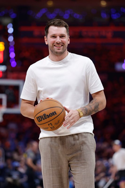 May 7, 2026; Oklahoma City, Oklahoma, USA; Los Angeles Lakers guard Luka Doncic (77) smiles during a time out against the Oklahoma City Thunder in the second half during game two of the second round of the 2026 NBA Playoffs at Paycom Center. Mandatory Credit: Alonzo Adams-Imagn Images