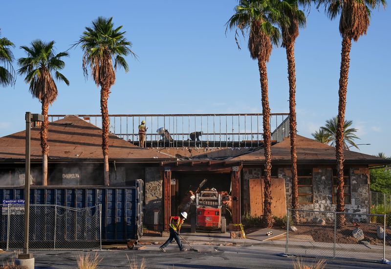 A demolition crew works Wednesday, May 13, gutting the building that was formerly Roy’s Hawaiian Fusion restaurant on Highway 111 just east of Bob Hope Drive in Rancho Mirage.