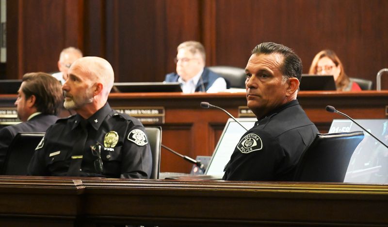 Ventura City Police Chief David Dickey, right, and Cmdr. Ted Caliento listen to speakers at the Ventura City Council meeting on May 12. The council voted to support a ban on kratom and nitrous oxide sales.
