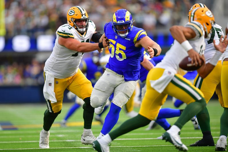 Oct 6, 2024; Inglewood, California, USA; Los Angeles Rams defensive tackle Braden Fiske (55) moves in against Green Bay Packers quarterback Jordan Love (10) as center Josh Myers (71) provides coverageduring the second half at SoFi Stadium. Mandatory Credit: Gary A. Vasquez-Imagn Images