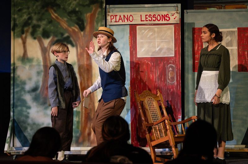 Valley Life Charter School students Mark Thompson, left, Shelby O'Hara and Aria Saenz rehearse for their production of The Music Man on Wednesday, May 13, 2026.