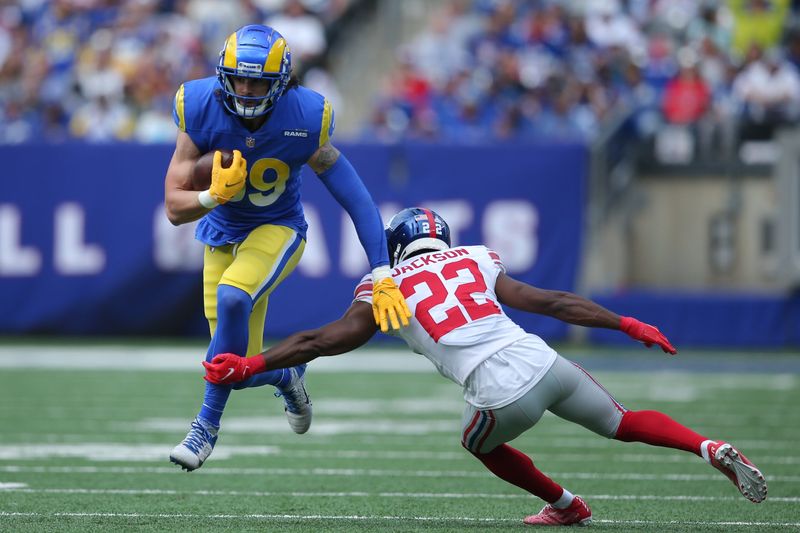 Oct 17, 2021; East Rutherford, New Jersey, USA; Los Angeles Rams tight end Tyler Higbee (89) runs with the ball against New York Giants cornerback Adoree' Jackson (22) during the second quarter at MetLife Stadium. Mandatory Credit: Brad Penner-USA TODAY Sports