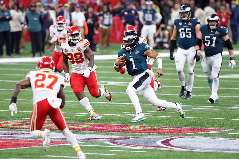 Feb 9, 2025; New Orleans, LA, USA; Philadelphia Eagles quarterback Jalen Hurts (1) runs with the ball against the Kansas City Chiefs during the second half of Super Bowl LIX at Caesars Superdome. Mandatory Credit: Bill Streicher-Imagn Images