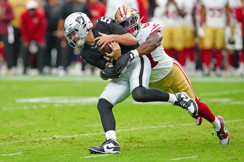 Aug 16, 2025; Paradise, Nevada, USA; San Francisco 49ers offensive tackle Isaac Alarcon (67) sacks Las Vegas Raiders quarterback Cam Miller (5) during the fourth quarter at Allegiant Stadium. Mandatory Credit: Stephen R. Sylvanie-Imagn Images
