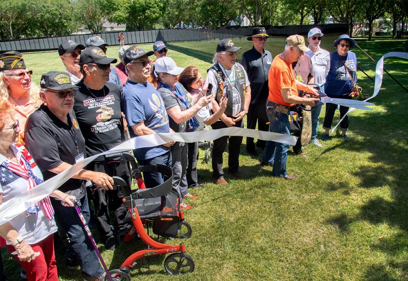 Vietnam veterans and their families participate in a ribbon cutting at the opening ceremony of the Moving Wall at the Weber Point Events Center in downtown Stockton on May, 14, 2026. The wall is a traveling half-scale replica of the Vietnam Veterans Memorial in Washington D.C. and will be on display in Stockton to the public until Monday, May 18.