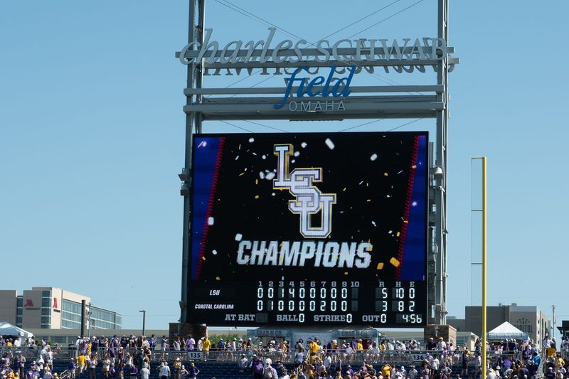 Jun 22, 2025; Omaha, Neb, USA; Signage on the field after the game between the Coastal Carolina Chanticleers and the LSU Tigers at Charles Schwab Field. Mandatory Credit: Steven Branscombe-Imagn Images