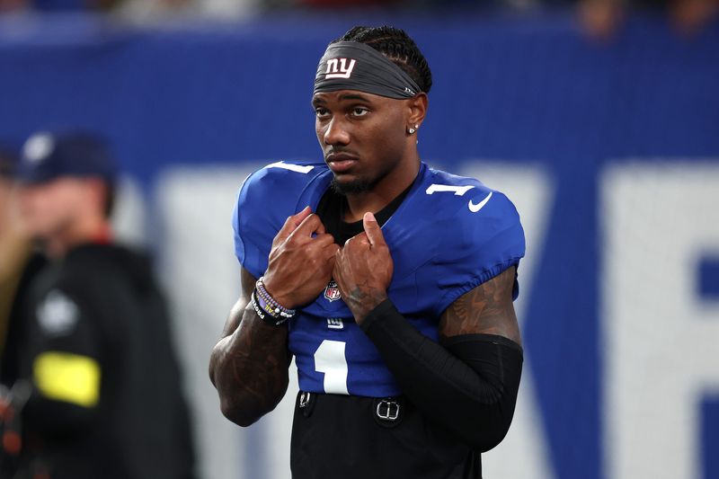 Sep 21, 2025; East Rutherford, New Jersey, USA; New York Giants wide receiver Malik Nabers (1) looks on before the game against the Kansas City Chiefs at MetLife Stadium. Mandatory Credit: Vincent Carchietta-Imagn Images