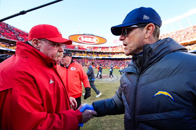 Dec 14, 2025; Kansas City, Missouri, USA; Kansas City Chiefs head coach Andy Reid, left, and Los Angeles Chargers head coach Jim Harbaugh shake hands following a Chargers victory at GEHA Field at Arrowhead Stadium. Mandatory Credit: Jay Biggerstaff-Imagn Images