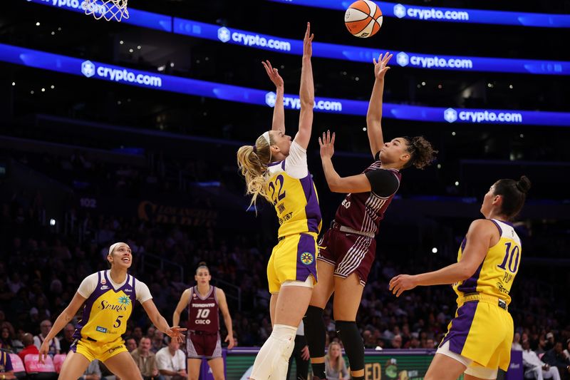 May 15, 2026; Los Angeles, California, USA; Toronto Tempo guard Kiki Rice (1) shoots the ball over Los Angeles Sparks forward Cameron Brink (22) during the first quarter at Crypto.com Arena. Mandatory Credit: Kiyoshi Mio-Imagn Images