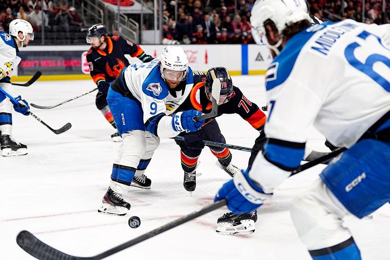 Colorado Eagles center T.J. Tynan (9) and Firebirds forward Oscar Fisker Molgaard (78) compete in game two of the Pacific Division Finals at Acrisure Arena in Palm Desert, Calif., on Friday, May 15, 2026. Firebirds won 4-0.