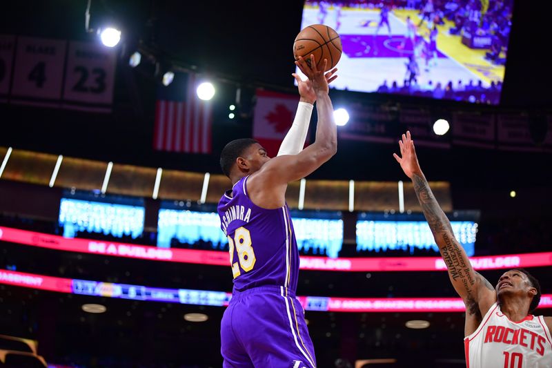 Apr 29, 2026; Los Angeles, California, USA; Los Angeles Lakers forward Rui Hachimura (28) shoots against Houston Rockets forward Jabari Smith Jr. (10) during the first half in game five of the first round of the 2026 NBA Playoffs at Crypto.com Arena. Mandatory Credit: Gary A. Vasquez-Imagn Images