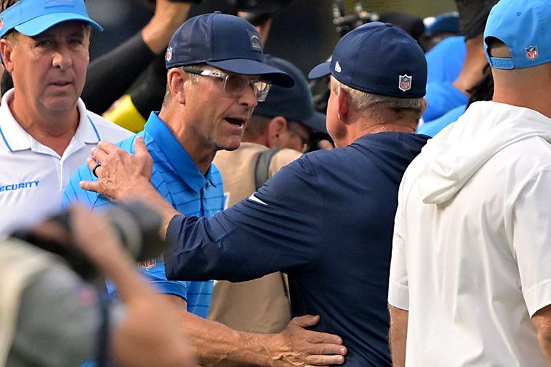 Sep 21, 2025; Inglewood, California, USA; Los Angeles Chargers head coach Jim Harbaugh shakes hands with Denver Broncos head coach Sean Payton after the game at SoFi Stadium. Mandatory Credit: Jayne Kamin-Oncea-Imagn Images