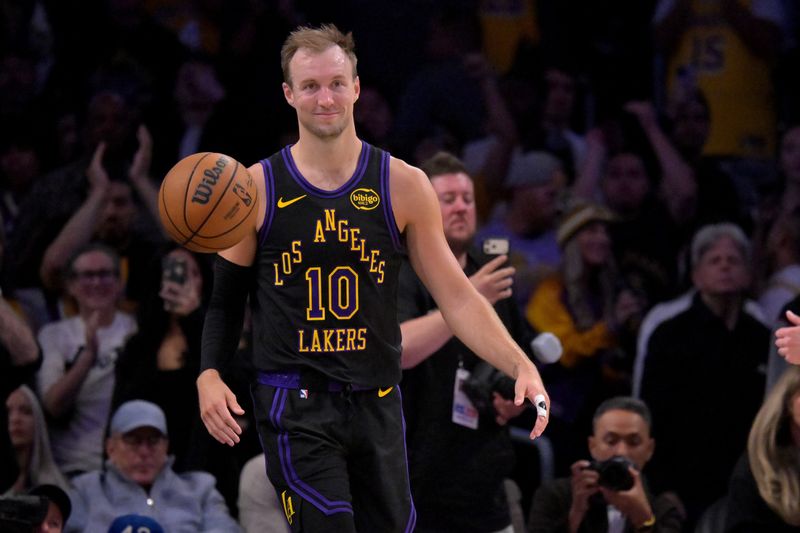 Apr 21, 2026; Los Angeles, California, USA; Los Angeles Lakers guard Luke Kennard (10) smiles on the court during the final seonds of game two of the first round of the 2026 NBA Playoffs at against the Houston Rockets at Crypto.com Arena. Mandatory Credit: Jayne Kamin-Oncea-Imagn Images