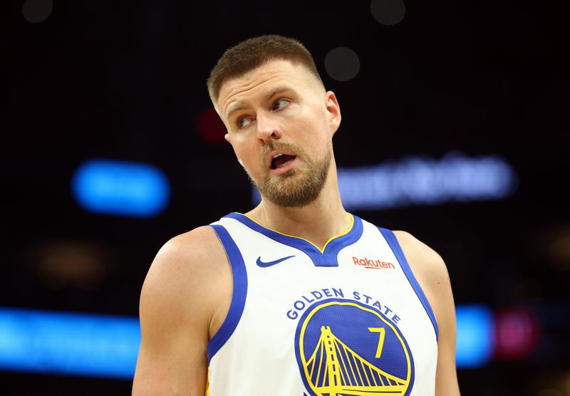 Apr 17, 2026; Phoenix, Arizona, USA; Golden State Warriors center Kristaps Porzingis (7) against the Phoenix Suns during the play-in rounds of the 2026 NBA Playoffs at Mortgage Matchup Center. Mandatory Credit: Mark J. Rebilas-Imagn Images