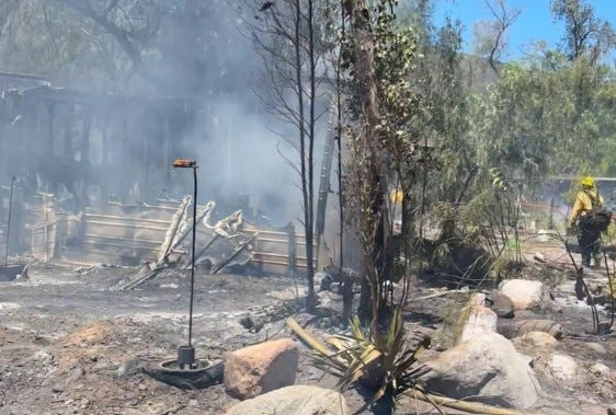 A brush fire, dubbed the Cajon Fire, scorched more than 5 acres of vegetation and damaged four structures near the Cajon Pass in San Bernardino County on Monday, May 18, 2026.