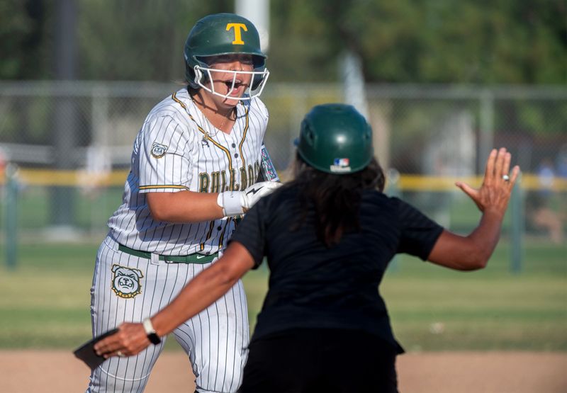 Tracy’s Nevaeh Reynoso is congratulated by head coach Paulette Keeney after hitting a home run during the Sac-Joaquin Section Div. II Softball semifinal against Elk Grove at the Tracy Softball Complex in Tracy on May, 19, 2026. Elk Grove won in extra innings 12-10.