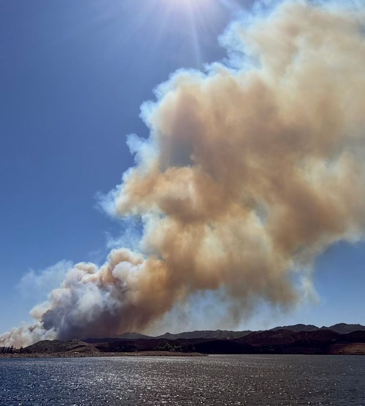 Thick plumes of smoke from the Sandy Fire as seen from the Calleguas Municipal Water District's Lake Bard in May 2026. The Thousand Oaks reservoir was a primary source of water for aerial firefighting operations.