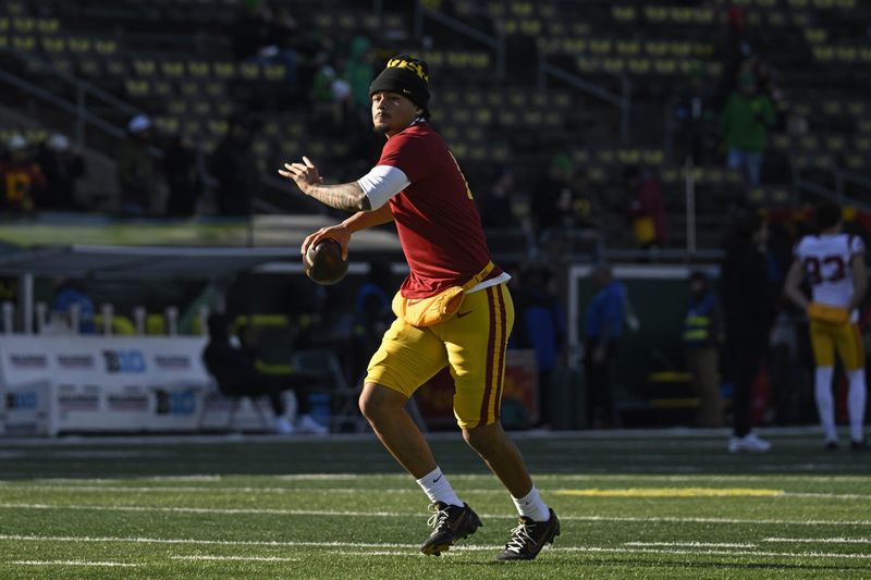 Nov 22, 2025; Eugene, Oregon, USA; Southern California Trojans quarterback Jayden Maiava (14) warms up before the game against the Oregon Ducks at Autzen Stadium. Mandatory Credit: Troy Wayrynen-Imagn Images