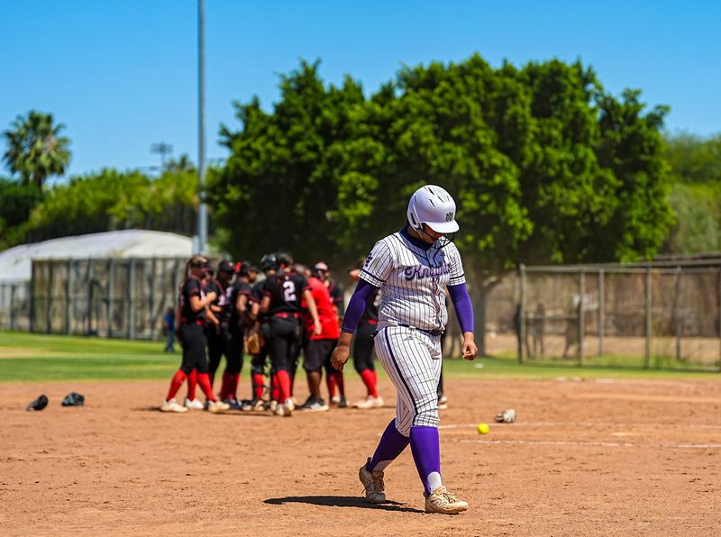 Shadow Hills' Gianna Hernandez walks back to the dugout as Grace players celebrate winning their CIF-SS Division 5 quarterfinal game 6-5 in Indio, Calif., Wednesday, May 20, 2026.