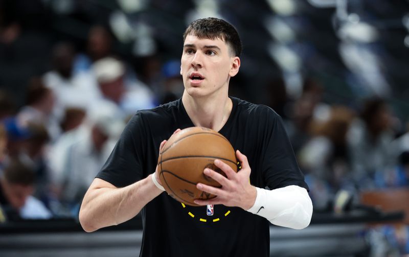 Apr 5, 2026; Dallas, Texas, USA; Los Angeles Lakers forward Jake LaRavia (12) warms up before the game against the Dallas Mavericks at American Airlines Center. Mandatory Credit: Kevin Jairaj-Imagn Images