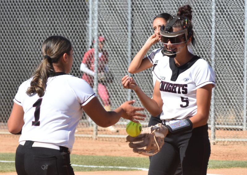 Riverside Prep's Breeanna Garcia hands the ball to Lila Morris during the fifth inning against La Serna in the CIF-Southern Section Division 3 quarterfinals on Wednesday, May 20, 2026. Riverside Prep is moving on to the semifinals with a 7-2 victory.