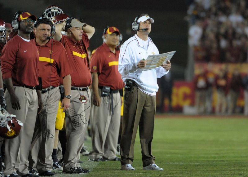Oct 29, 2011; Los Angeles, CA, USA; Southern California Trojans coach Lane Kiffin watches on the sidelines with assistant coaches Sammy Knight, Ed Orgeron, John Baxter, and Kennedy Polamalu during the game against the Stanford Cardinal at the Los Angeles Memorial Coliseum. Stanford defeated USC 56-48 in three overtimes. Mandatory Credit: Kirby Lee/Image of Sport-USA TODAY Sports
