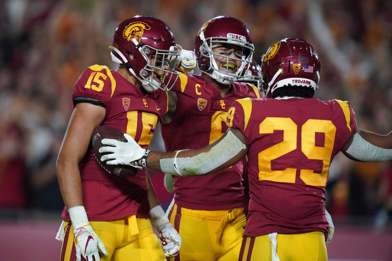 Sep 7, 2019; Los Angeles, CA, USA; Southern California Trojans wide receiver Drake London (15), wide receiver Michael Pittman Jr. (6) and running back Vavae Malepeai (29) celebrate after a touchdown against the Stanford Cardinal in the second half at Los Angeles Memorial Coliseum. USC defeated Stanford 45-20. Mandatory Credit: Kirby Lee-USA TODAY Sports