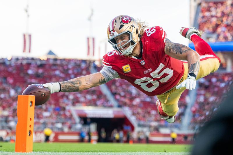 November 9, 2025; Santa Clara, California, USA; San Francisco 49ers tight end George Kittle (85) scores a touchdown during the fourth quarter against the Los Angeles Rams at Levi's Stadium. Mandatory Credit: Kyle Terada-Imagn Images