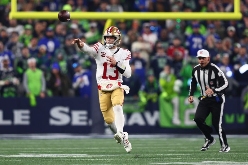 Jan 17, 2026; Seattle, WA, USA; San Francisco 49ers quarterback Brock Purdy (13) throws downfield against the Seattle Seahawks during the first half in an NFC Divisional Round game at Lumen Field. Mandatory Credit: Kevin Ng-Imagn Images