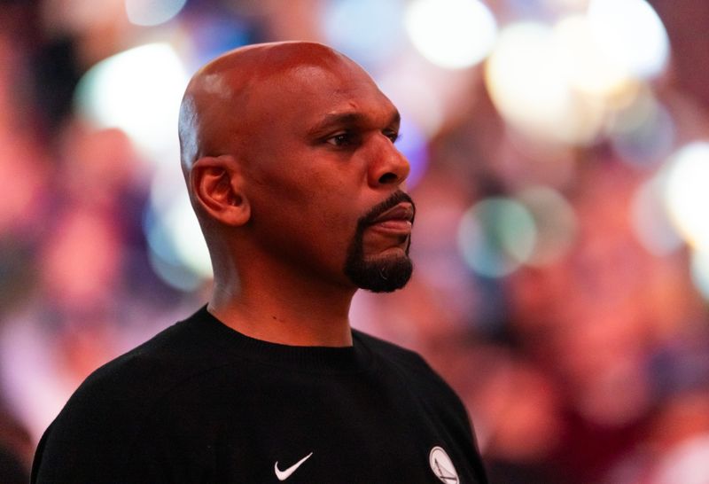 Feb 5, 2026; Phoenix, Arizona, USA; Golden State Warriors assistant coach Jerry Stackhouse against the Phoenix Suns at Mortgage Matchup Center. Mandatory Credit: Mark J. Rebilas-Imagn Images