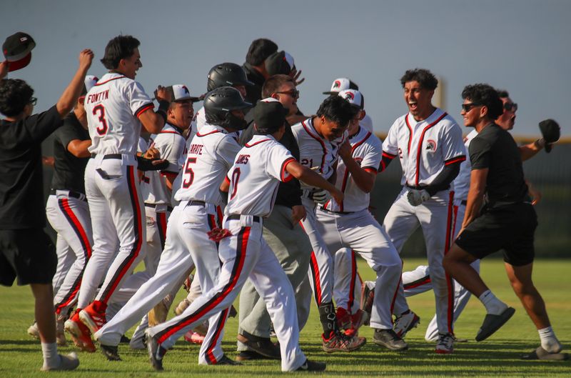 Rio Mesa baseball players celebrates with Rob Rodriguez, who hit a walk-off double in the eighth inning to defeat Saugus 2-1 in a CIF-Southern Section Division 4 quarterfinal game on Friday, May 22, 2026, in Oxnard.