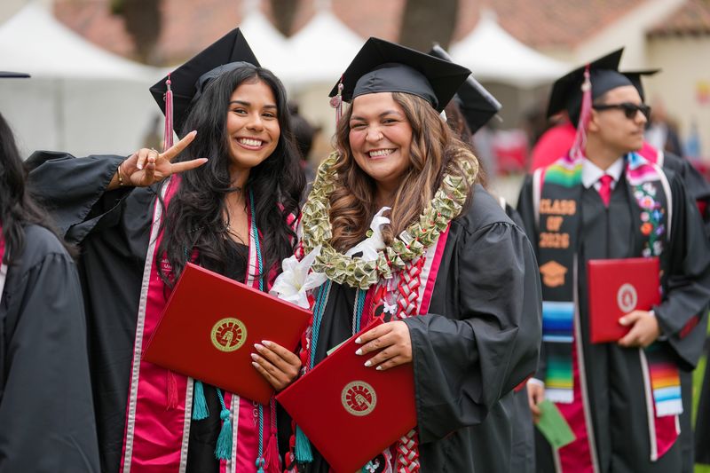 CSU Channel Islands Class of 2026 graduates pose for a photo during the first of two commencement ceremonies on the Camarillo campus May 23.