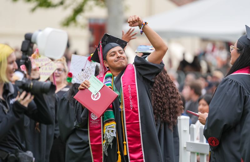 CSU Channel Islands graduate Brayan Lopez Santos pumps his fist during the first of two commencements for the class of 2026 on the Camarillo campus May 23, 2026.