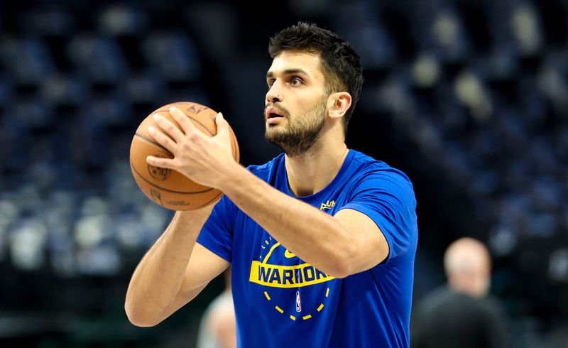 Mar 23, 2026; Dallas, Texas, USA; Golden State Warriors center Omer Yurtseven (77) warms up before the game against the Dallas Mavericks American Airlines Center. Mandatory Credit: Kevin Jairaj-Imagn Images