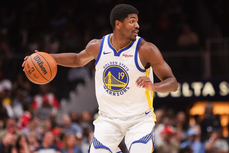 Mar 21, 2026; Atlanta, Georgia, USA; Golden State Warriors guard Nate Williams (19) dribbles against the Atlanta Hawks in the fourth quarter at State Farm Arena. Mandatory Credit: Brett Davis-Imagn Images