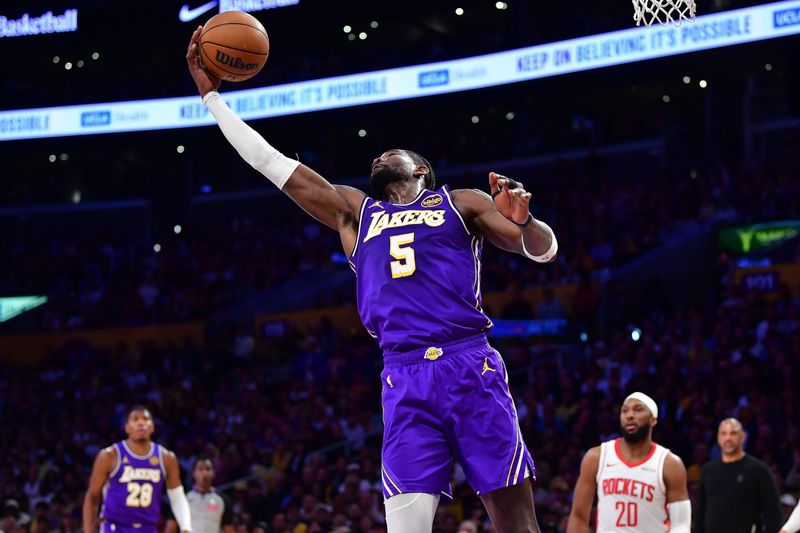 Apr 29, 2026; Los Angeles, California, USA; Los Angeles Lakers center Deandre Ayton (5) gets a rebound against the Houston Rockets during the first half in game five of the first round of the 2026 NBA Playoffs at Crypto.com Arena. Mandatory Credit: Gary A. Vasquez-Imagn Images