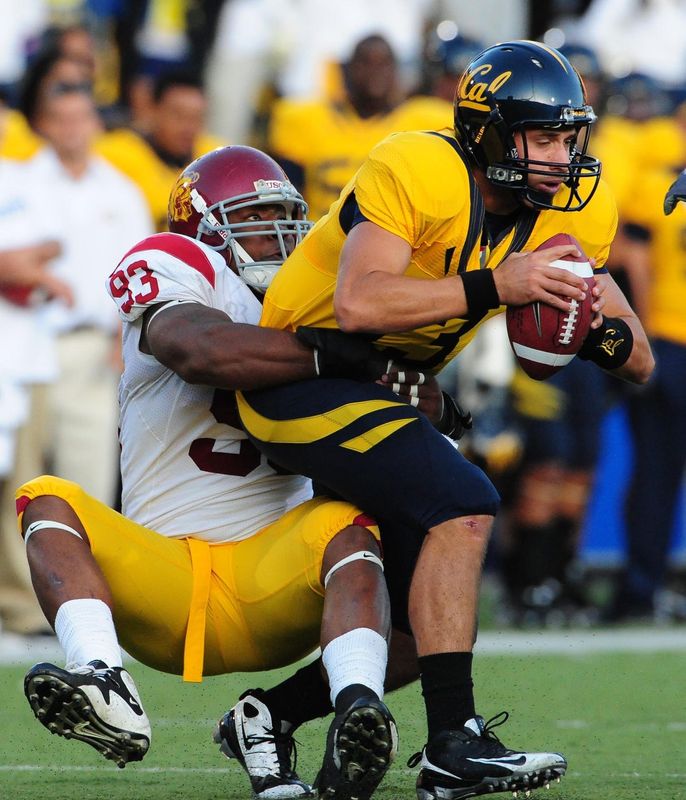 October 3, 2009; Berkeley, CA, USA; California Golden Bears quarterback Kevin Riley (right) is sacked by USC Trojans defensive end Everson Griffen (93) during the second quarter at Memorial Stadium. Mandatory Credit: Kyle Terada-USA TODAY Sports